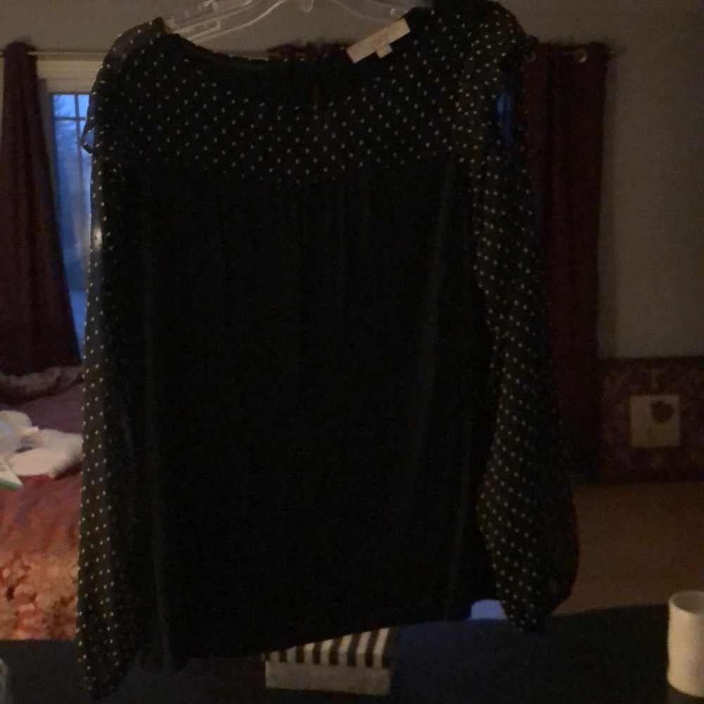 Pretty long sleeve black top from the Loft. Good condition
